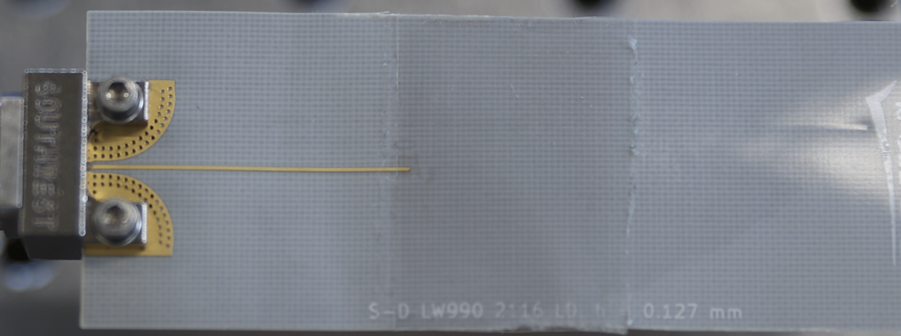 Transparent antenna interfaced to a connector